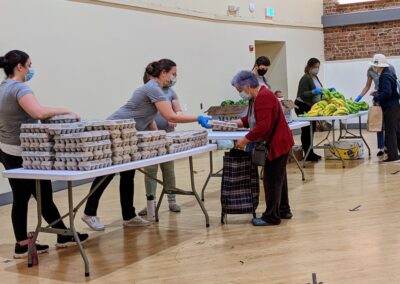 Waymo volunteers distributing food at Food Pantry